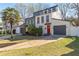 Modern two-story home with colorful doors, brick facade, garage, and well-manicured lawn at 549 Ne Parkway Ne Dr, Atlanta, GA 30308