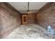 Spacious garage featuring brick walls and high ceilings, offering ample storage and parking at 549 Ne Parkway Ne Dr, Atlanta, GA 30308