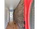 Welcoming hallway with hardwood floors and a red front door, inviting guests into a stylish home at 549 Ne Parkway Ne Dr, Atlanta, GA 30308