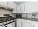 This kitchen shows stainless steel appliances, white cabinets, granite countertops at 549 Ne Parkway Ne Dr, Atlanta, GA 30308