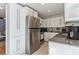 Well-lit kitchen with stainless steel appliances, white cabinets, and granite countertops at 549 Ne Parkway Ne Dr, Atlanta, GA 30308