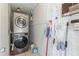 Functional laundry room with stacked washer and dryer, maximizing space and convenience at 549 Ne Parkway Ne Dr, Atlanta, GA 30308