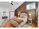 Stylish bedroom with brick accent wall, modern décor, and ensuite bathroom at 549 Ne Parkway Ne Dr, Atlanta, GA 30308