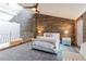 Spacious bedroom with high ceilings, brick accent wall, and a loft-style layout at 549 Ne Parkway Ne Dr, Atlanta, GA 30308