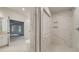Detailed bathroom with a glass-enclosed shower and a large tub; connects to the spacious main bedroom at 165 Cooper E Cv, Fayetteville, GA 30215