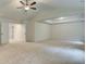 Large bedroom with a ceiling fan, recessed lighting, and access to walk-in closet and bathroom at 165 Cooper E Cv, Fayetteville, GA 30215