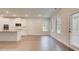 Bright kitchen and breakfast nook with new appliances, lots of windows, and a door to the patio at 165 Cooper E Cv, Fayetteville, GA 30215