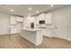 Stylish kitchen featuring granite countertops, stainless steel appliances, and ample white cabinet space at 165 Cooper E Cv, Fayetteville, GA 30215