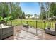 Outdoor deck with ample seating area overlooking the backyard at 1752 Shadybrook Ct, Lawrenceville, GA 30043
