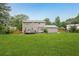 Large, green backyard featuring a spacious lawn and a well-maintained wooden fence at 1752 Shadybrook Ct, Lawrenceville, GA 30043