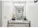 Clean bathroom with granite countertop vanity and plenty of light at 1752 Shadybrook Ct, Lawrenceville, GA 30043