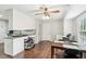 Eat-in kitchen featuring stainless steel appliances, laminate floors, and a casual dining area at 1752 Shadybrook Ct, Lawrenceville, GA 30043