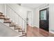 Inviting entryway with hardwood floors, staircase, and decorative front door at 1752 Shadybrook Ct, Lawrenceville, GA 30043