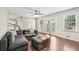 Comfortable living room with hardwood floors, natural light, and access to the backyard at 1752 Shadybrook Ct, Lawrenceville, GA 30043