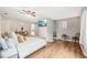 Spacious main bedroom offers natural light, stylish furnishings, and wood-look laminate flooring at 1752 Shadybrook Ct, Lawrenceville, GA 30043