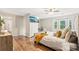Spacious main bedroom offers natural light, stylish furnishings, and wood-look laminate flooring at 1752 Shadybrook Ct, Lawrenceville, GA 30043