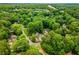 Lush green trees surround homes in an aerial view, highlighting established neighborhood landscaping and well-maintained properties at 360 Spindle Ct, Sandy Springs, GA 30350