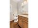 Half bath with wood vanity, granite counters, and modern fixtures at 360 Spindle Ct, Sandy Springs, GA 30350