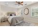 A stylish bedroom with large windows, neutral colors, and plush furnishings at 360 Spindle Ct, Sandy Springs, GA 30350
