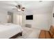This bedroom features a ceiling fan, TV, and comfortable seating, perfect for relaxation and entertainment at 360 Spindle Ct, Sandy Springs, GA 30350
