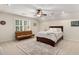 Bright bedroom featuring a ceiling fan and a comfortable bed, accented by a stylish area rug at 360 Spindle Ct, Sandy Springs, GA 30350