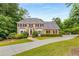 Stately brick home with manicured lawn and lush landscaping at 360 Spindle Ct, Sandy Springs, GA 30350