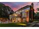 Elegant home exterior with a brick facade, balcony, patio, and professionally landscaped yard at 360 Spindle Ct, Sandy Springs, GA 30350