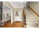 Elegant foyer with hardwood floors, patterned wallpaper, and staircase leading to the upper level at 360 Spindle Ct, Sandy Springs, GA 30350