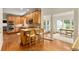 Spacious kitchen with wood cabinets, granite countertops, stainless steel appliances, and breakfast bar at 360 Spindle Ct, Sandy Springs, GA 30350