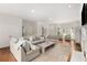 Spacious living room with ample seating, a fireplace, and abundant natural light from large windows at 360 Spindle Ct, Sandy Springs, GA 30350