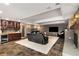 Finished basement with fireplace, wet bar, tile flooring, and comfortable seating perfect for entertaining and relaxing at 360 Spindle Ct, Sandy Springs, GA 30350