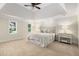 Spacious primary bedroom with tray ceilings, neutral décor, carpet, and abundant natural light at 360 Spindle Ct, Sandy Springs, GA 30350