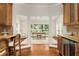 Office area with built in bar, hardwood floors, large windows, adjacent to dining area at 360 Spindle Ct, Sandy Springs, GA 30350
