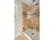 Tiled shower with glass door, a shower head, and a convenient shower seat at 360 Spindle Ct, Sandy Springs, GA 30350