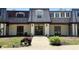 Charming townhome with a symmetrical design and well-maintained landscaping at 125 Rue Fontaine, Lithonia, GA 30038