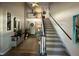 Inviting foyer with staircase, showcasing neutral tones and decorative accents at 125 Rue Fontaine, Lithonia, GA 30038