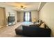 Cozy living room with tile floors, couch, and patio doors at 125 Rue Fontaine, Lithonia, GA 30038