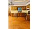 Traditional kitchen with wood cabinets, stainless appliances, and hardwood flooring at 1905 Sidneys Cv, Lawrenceville, GA 30043