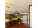 Classic kitchen featuring wood cabinets, stainless steel appliances, and decorative wallpaper at 1905 Sidneys Cv, Lawrenceville, GA 30043