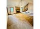 Spacious living room with stone fireplace and staircase to upper level at 1905 Sidneys Cv, Lawrenceville, GA 30043