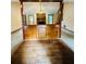 Open living room with hardwood floors and stone fireplace at 1905 Sidneys Cv, Lawrenceville, GA 30043