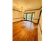 Inviting living room featuring gleaming hardwood floors and a bright bay window, perfect for relaxation at 1905 Sidneys Cv, Lawrenceville, GA 30043