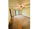 Spacious living room with neutral carpet, ceiling fan, and large windows that provide lots of natural light at 1905 Sidneys Cv, Lawrenceville, GA 30043