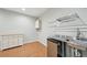 Finished basement kitchenette area complete with storage, stainless sink and mini-fridge at 223 Falling Water Way, Woodstock, GA 30188