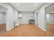 Spacious basement area with wood-look flooring and recessed lighting, ready for customization at 223 Falling Water Way, Woodstock, GA 30188