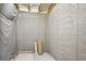 Unfinished basement with exposed insulation and bare concrete walls, great for storage or future finishing at 223 Falling Water Way, Woodstock, GA 30188