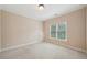Bedroom with neutral carpet and a single window at 223 Falling Water Way, Woodstock, GA 30188