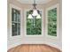Bright breakfast nook with bay windows, hardwood floors and backyard views at 223 Falling Water Way, Woodstock, GA 30188