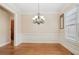 Formal dining room features elegant wainscoting and ample natural light at 223 Falling Water Way, Woodstock, GA 30188
