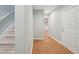 Hallway features wood floors and carpeted stairs at 223 Falling Water Way, Woodstock, GA 30188